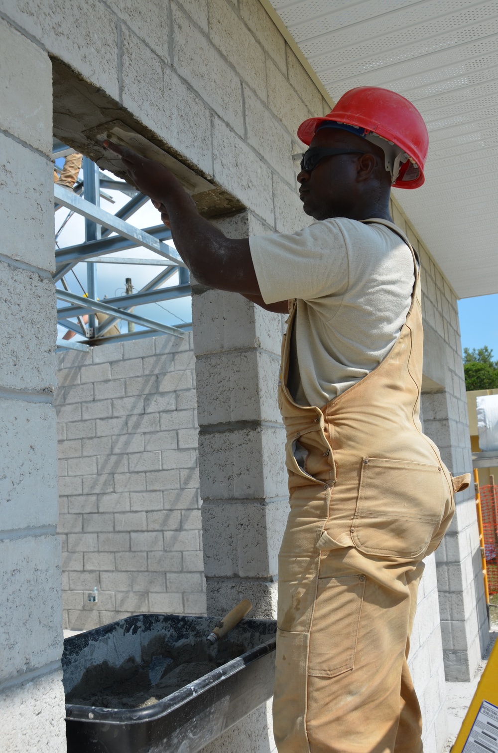 Engineers construct roof at Yorke school construction site in Belize City