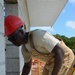 Engineers construct roof at Yorke school construction site in Belize City