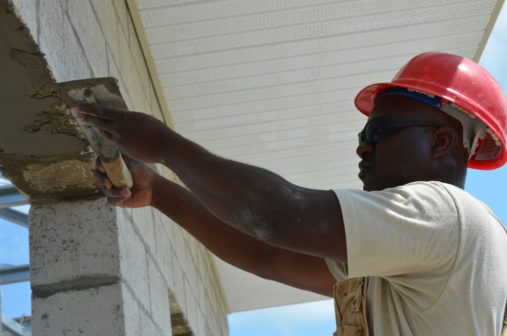 Engineers construct roof at Yorke school construction site in Belize City