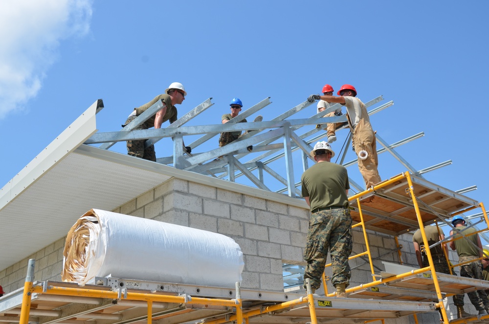 Engineers construct roof at Yorke school construction site in Belize City