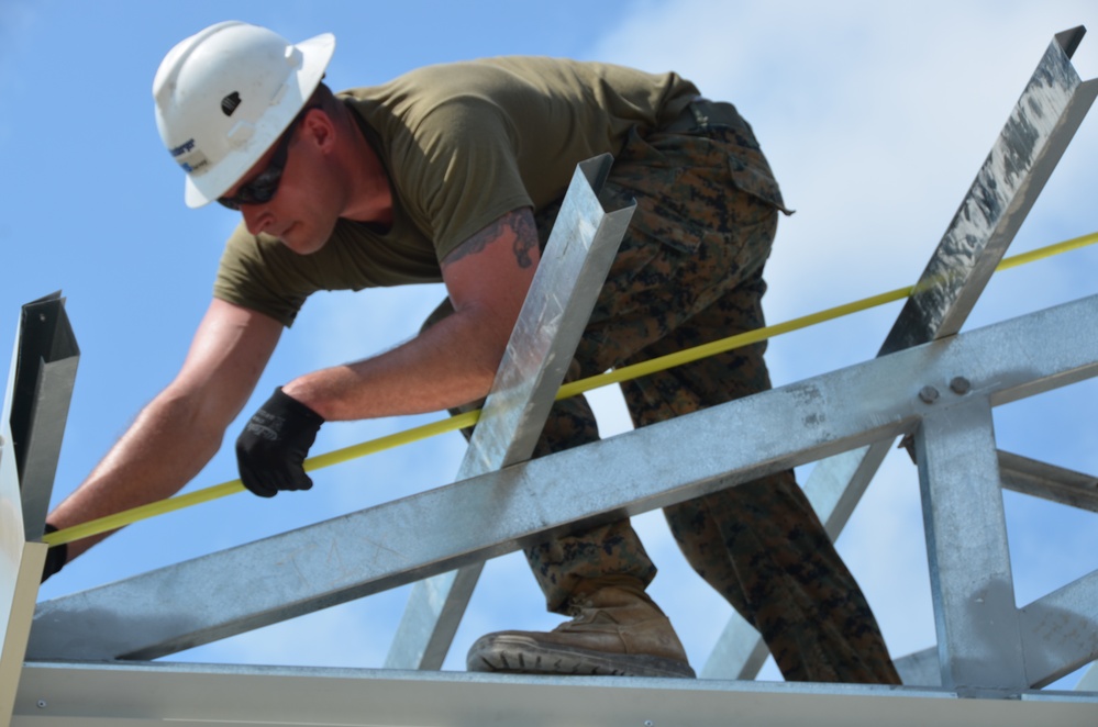 Engineers construct roof at Yorke school construction site in Belize City