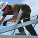 Engineers construct roof at Yorke school construction site in Belize City