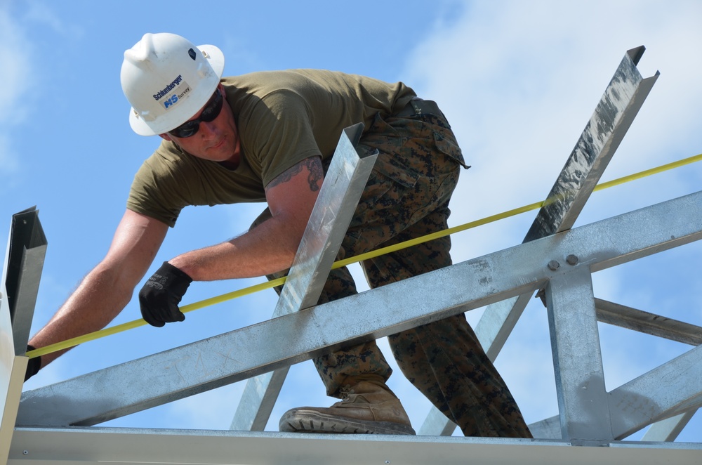 Engineers construct roof at Yorke school construction site in Belize City