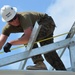 Engineers construct roof at Yorke school construction site in Belize City