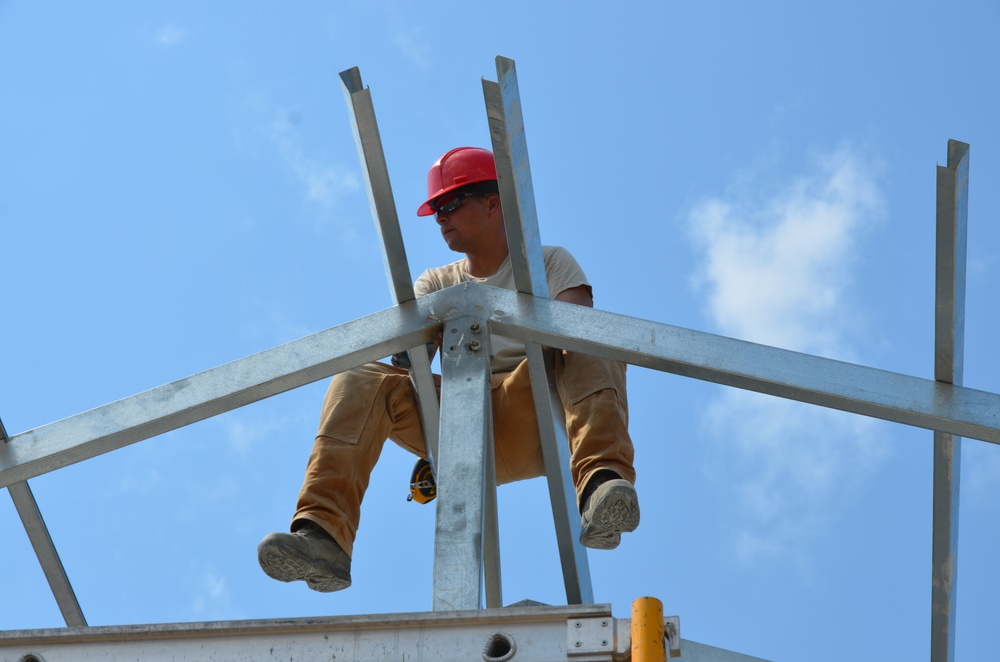 Engineers construct roof at Yorke school construction site in Belize City