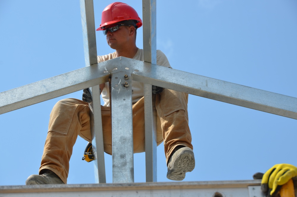 Engineers construct roof at Yorke school construction site in Belize City