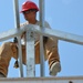 Engineers construct roof at Yorke school construction site in Belize City