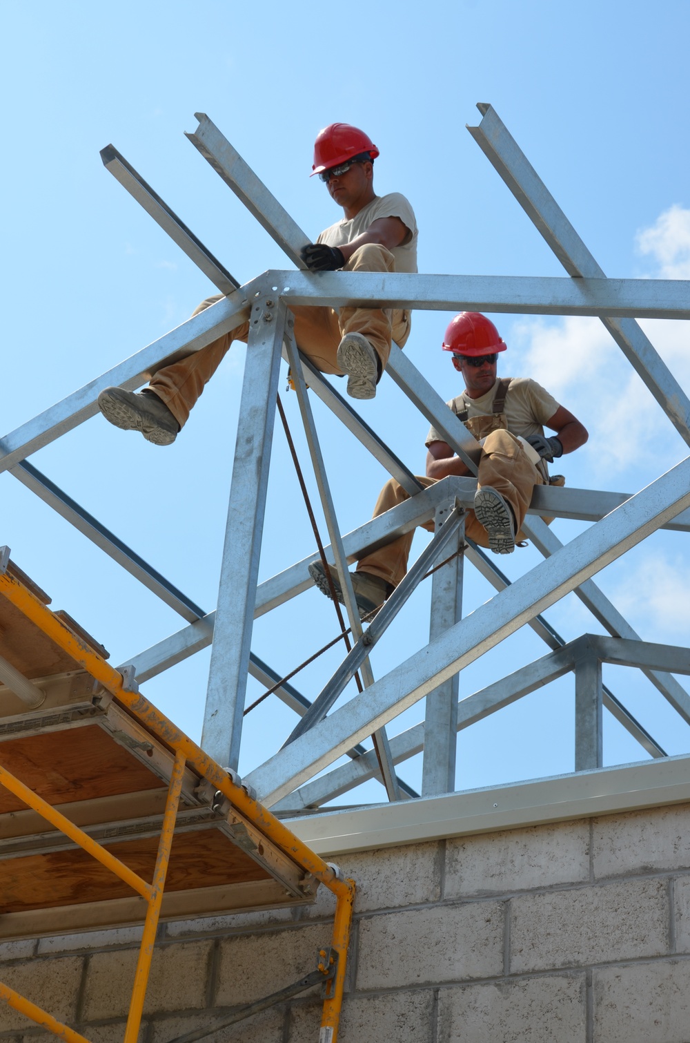 Engineers construct roof at Yorke school construction site in Belize City