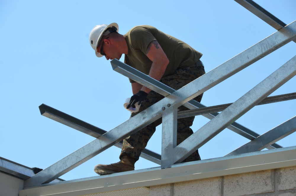 Engineers construct roof at Yorke school construction site in Belize City