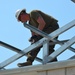 Engineers construct roof at Yorke school construction site in Belize City