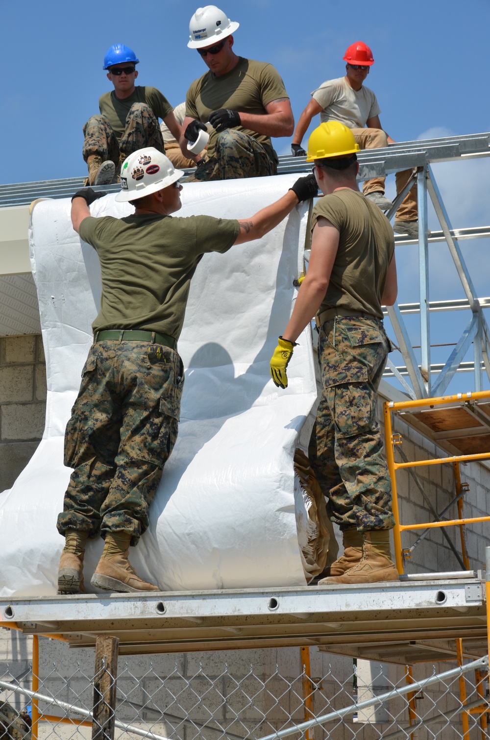 Engineers construct roof at Yorke school construction site in Belize City