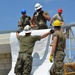 Engineers construct roof at Yorke school construction site in Belize City