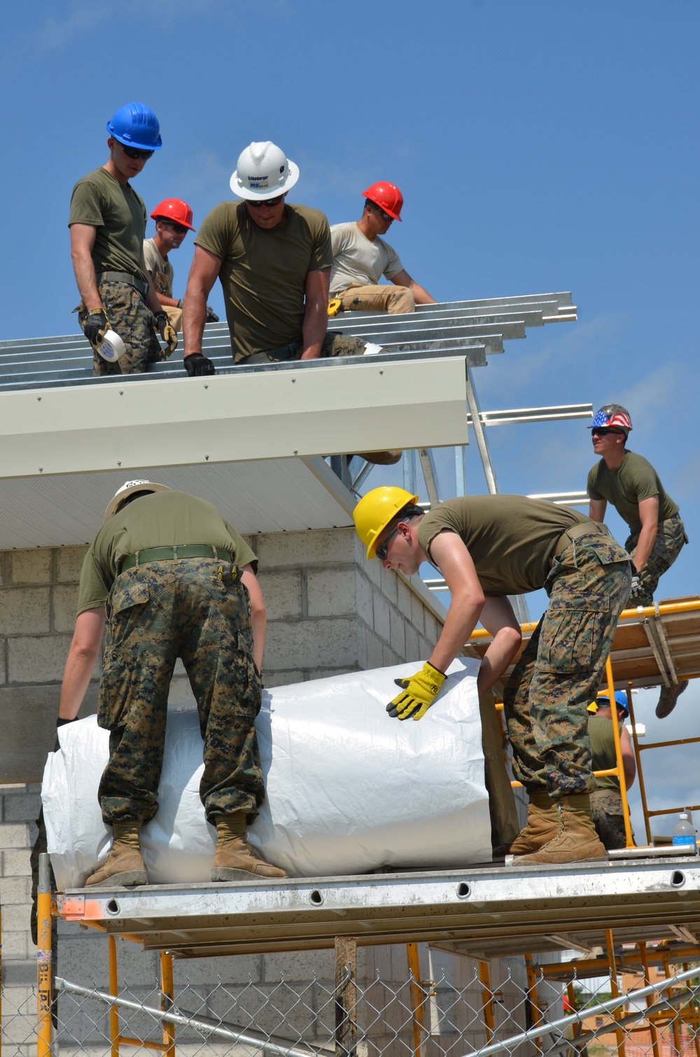 Engineers construct roof at Yorke school construction site in Belize City