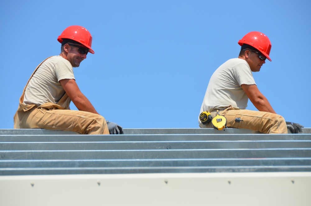 Engineers construct roof at Yorke school construction site in Belize City