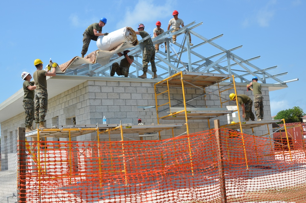 Engineers construct roof at Yorke school construction site in Belize City