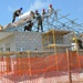 Engineers construct roof at Yorke school construction site in Belize City