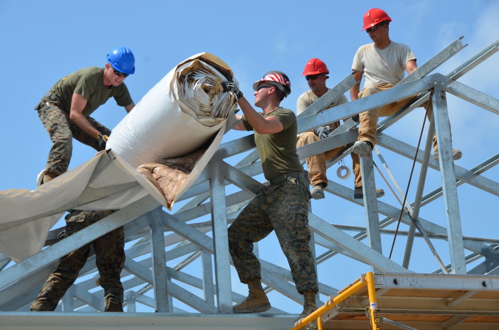 Engineers construct roof at Yorke school construction site in Belize City