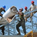 Engineers construct roof at Yorke school construction site in Belize City