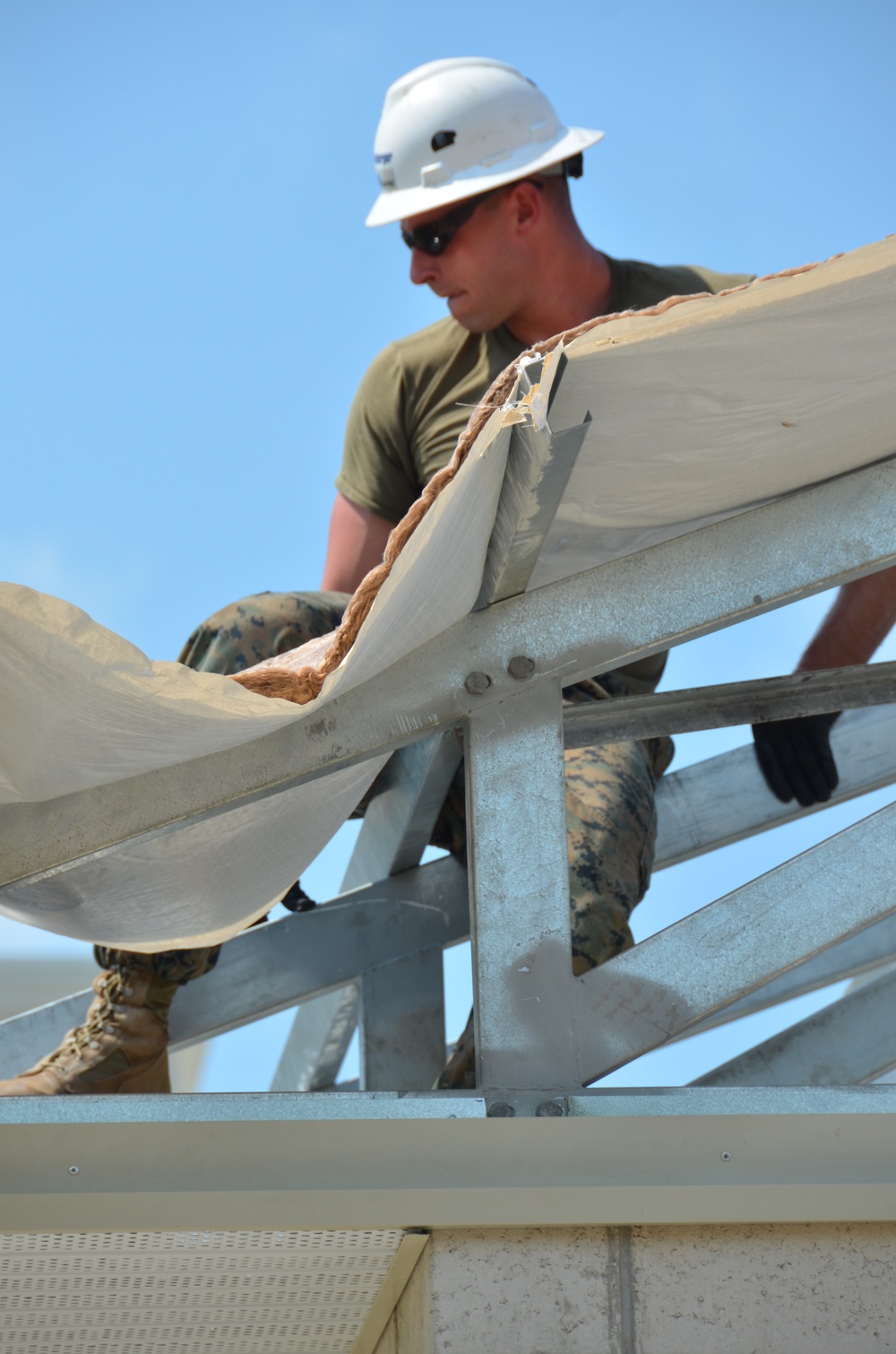 Engineers construct roof at Yorke school construction site in Belize City