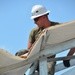 Engineers construct roof at Yorke school construction site in Belize City