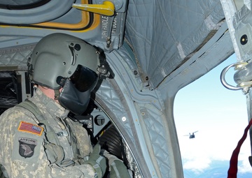 California National Guard Chinooks airlift Marines training in mountain warfare tactics to high elevation landing zones