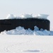 USS Connecticut surfaces through ice