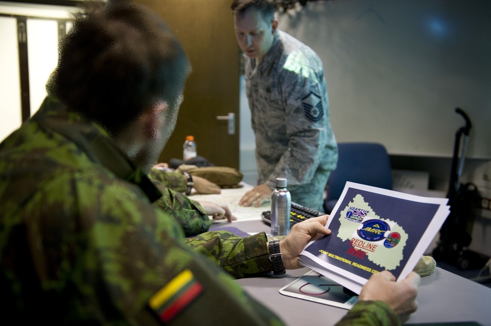Lithuanian Joint Terminal Attack Controllers receive feedback from after simulations training at JMRC
