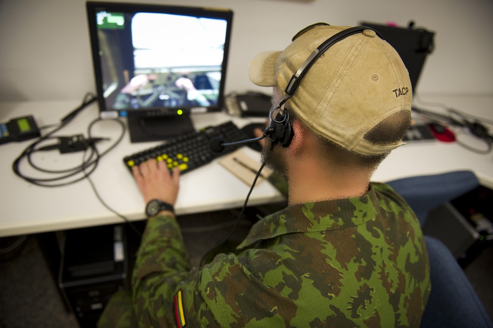 Lithuanian Joint Terminal Attack Controllers practice their skills using simulations equipment at JMRC