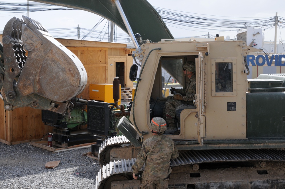 82nd SB-CMRE commander tests skills on hydraulic excavator with 1223rd Engineer Company