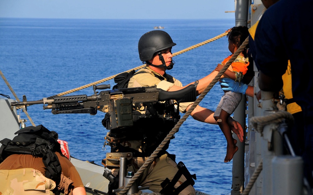 USS Lake Champlain sailors rescue disabled skiff passengers