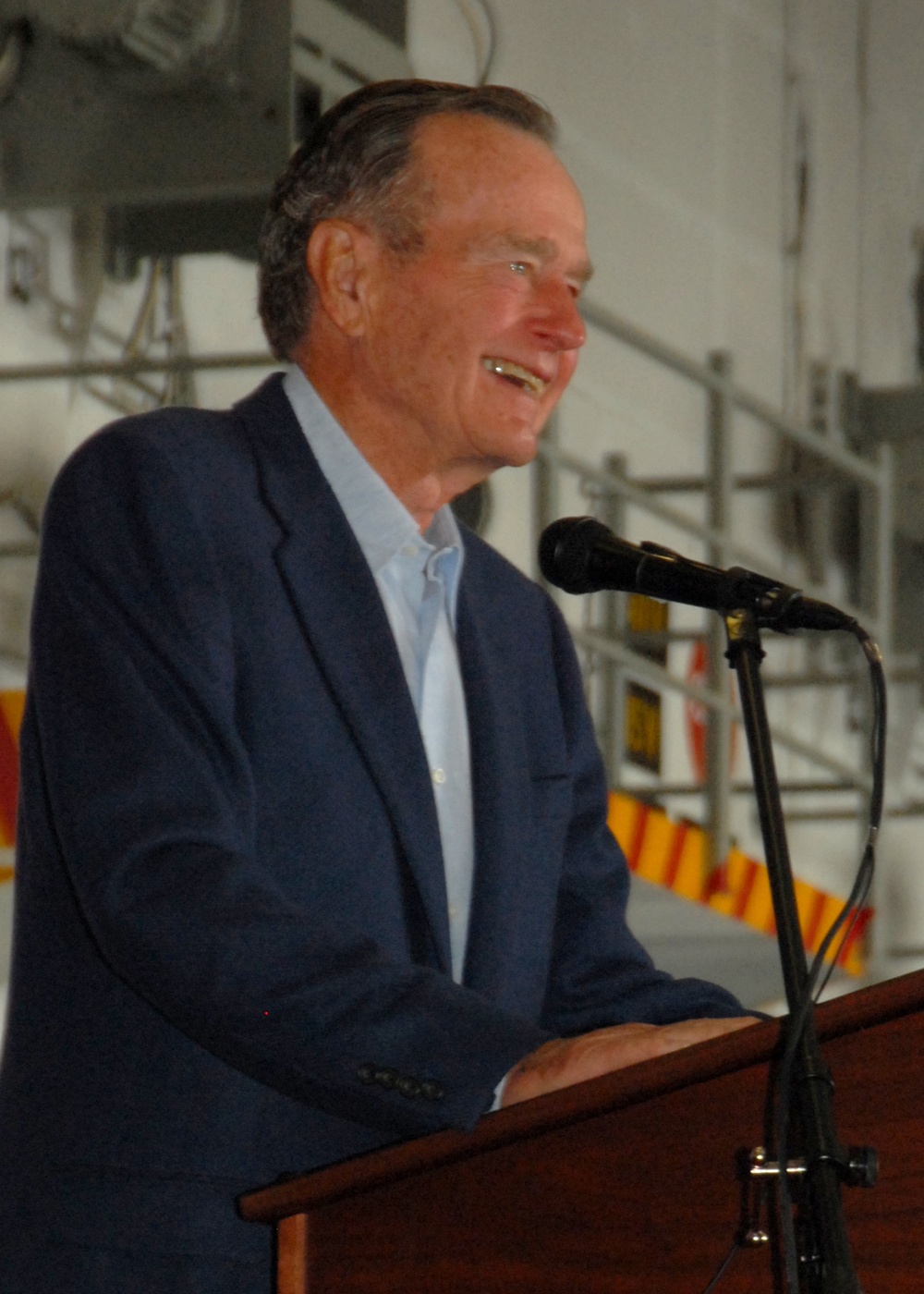 Former President George H.W. Bush speaks during re-enlistment, frocking ceremony