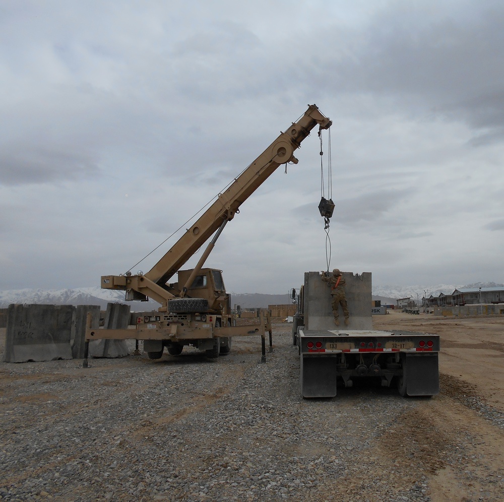 22- ton crane hooks concrete wall to be emplaced