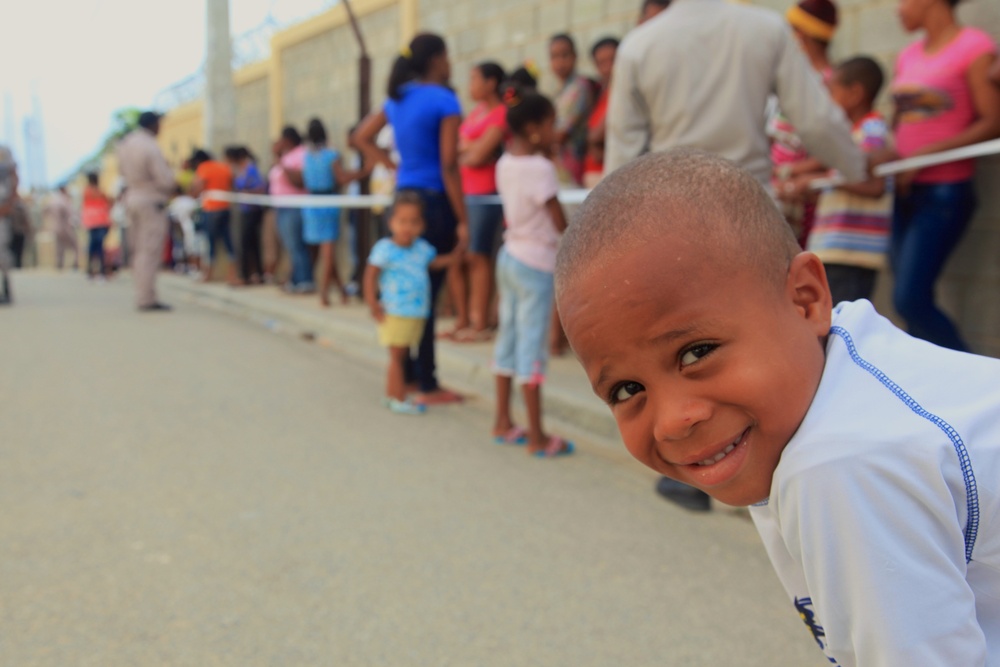Local children of the Dominican Republic wait in line for medical assistance during Beyond the Horizon 2014