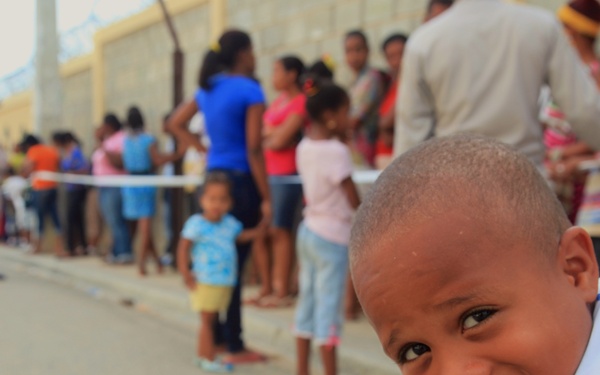 Local children of the Dominican Republic wait in line for medical assistance during Beyond the Horizon 2014