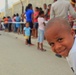 Local children of the Dominican Republic wait in line for medical assistance during Beyond the Horizon 2014