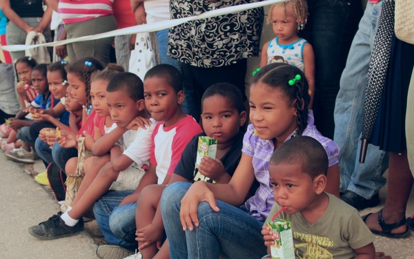Local children of the Dominican Republic wait in line for medical assistance during Beyond the Horizon 2014