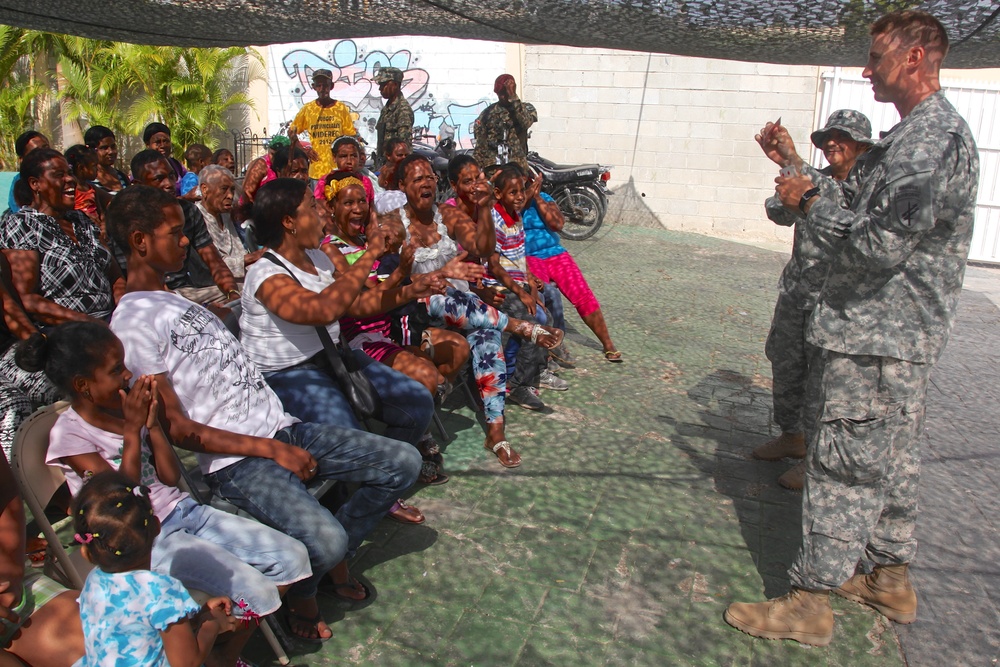 Local children of the Dominican Republic wait in line for medical assistance during Beyond the Horizon 2014