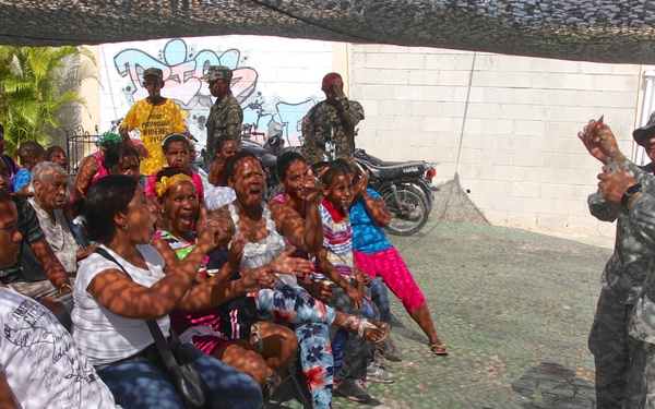 Local children of the Dominican Republic wait in line for medical assistance during Beyond the Horizon 2014