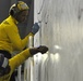 USS Peleliu aviation boatswain's mates paint wings