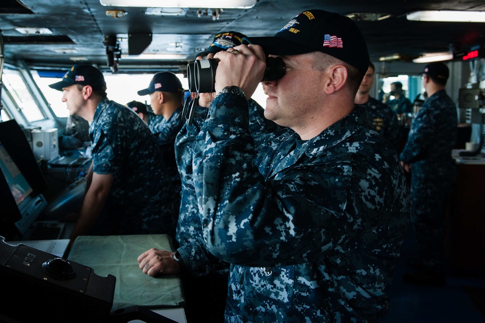 Stennis' navigation bridge team works during Stennis' departure from dry dock