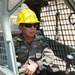 A Guatemalan engineer operates heavy equipment after training with U.S. Air Force engineers at the new school worksite at El Roble during Beyond the Horizon 2014 on April 10