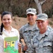 Susana Evangelina Paiz Gonzalez, the school director, smiles after receiving a gift from Tech. Sgt. Riley Kendrick April 17