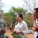 Staff Sgt. Joseph Dominic, a linguist with the 560th Battlefield Surveillance Brigade, Georgia Army National Guard, translates to smiling teachers as they tour the new school site in El Roble April 17