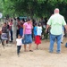 John Henry, a medical planner from 42nd Aeromedical Squadron, directs patients to the triage station during a Medical Readiness Training Exercise at Caseria Los Limones in Zacapa, Guatemala during Operation Beyond the Horizon April 21, 2014