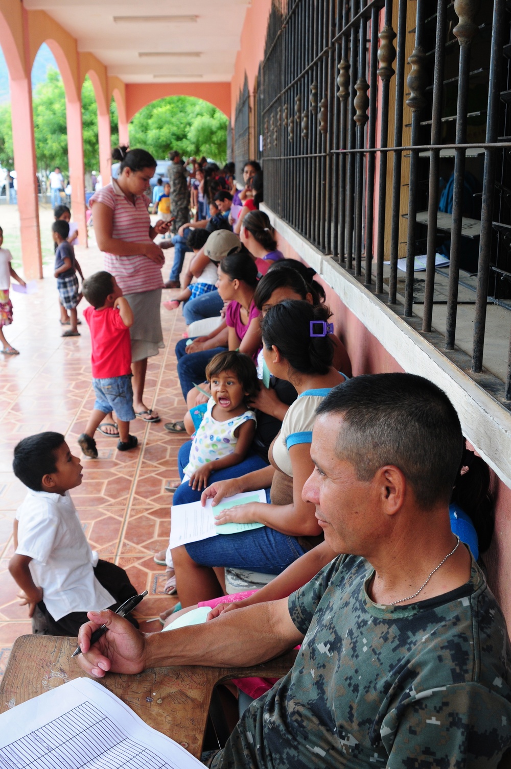 Patients wait in line for free dental care from a Medical Readiness Training Exercise at Caseria Los Limones in Zacapa, Guatemala as part of Operation Beyond the Horizon April 21, 2014