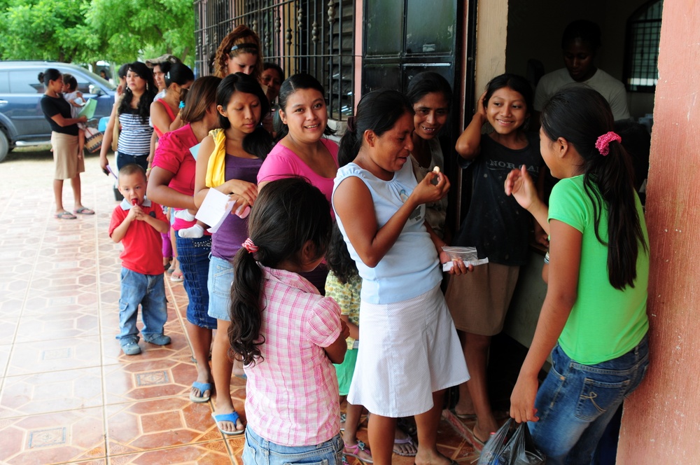 A local woman is surprised after receiving her prescription at the Medical Readiness Exercise being conducted at Caseria Los Limones as part of Operation Beyond the Horizon