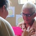 A woman wears glasses for the first time at an optometry clinic during a Medical Readiness Training Exercise at Caseria Los Limones Wednesday, April 23, 2014