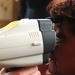 A local woman has her eyes scanned by an autorefractor at a Medical Readiness Training Exercise in Caseria Los Limones during Operation Beyond the Horizon Wednesday, April 23, 2014