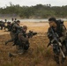 Marines dive toward objective during beach reconnaissance training