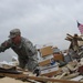 Soldier assists in cleanup efforts
